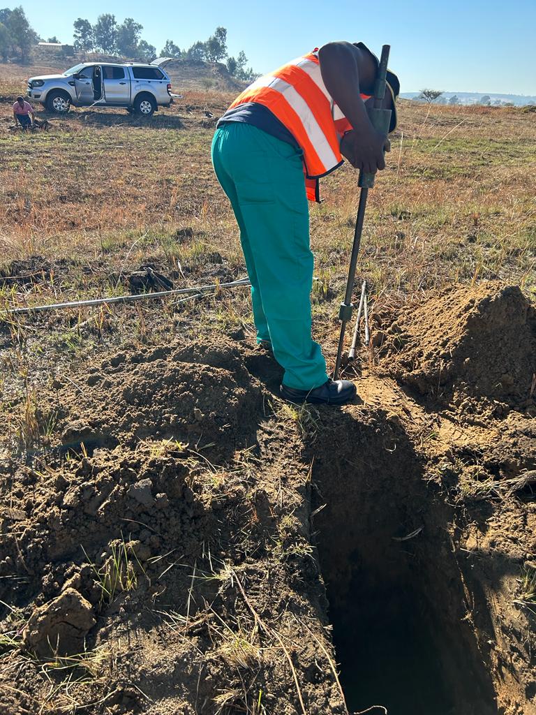 one of the employeees of ml geo consultation Engineers doing field work